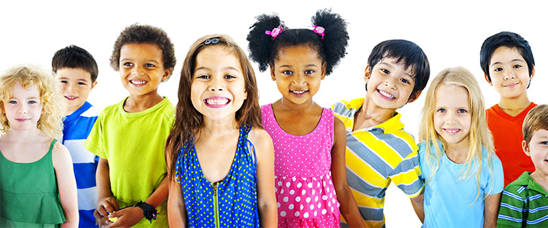 The image shows a group of diverse children smiling at the camera.